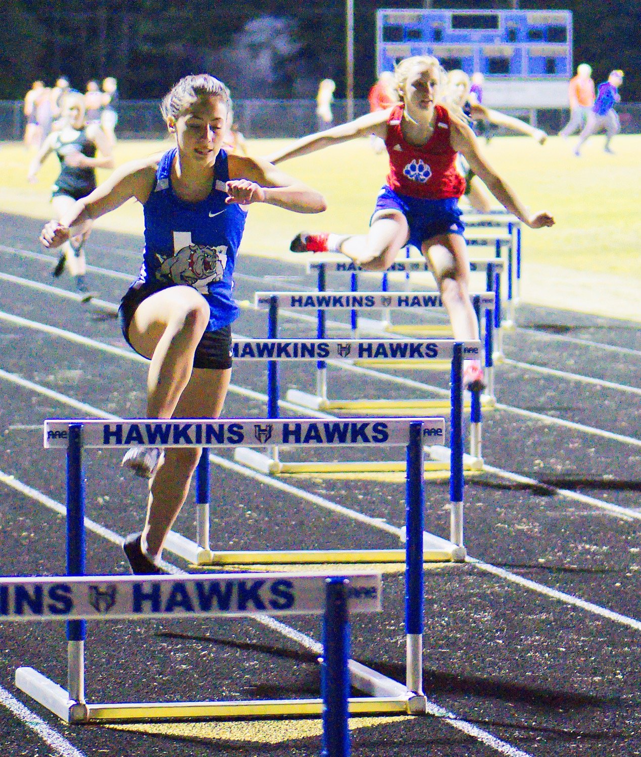 Brooklyn Marcee (left) and Bella Crawford compete in the 300m hurdles, in which they finished 1st and 3rd, respectively. [see more shots, put them on your wall]